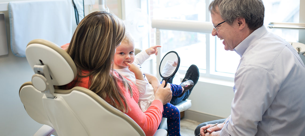 Dr. Lana helping young patient